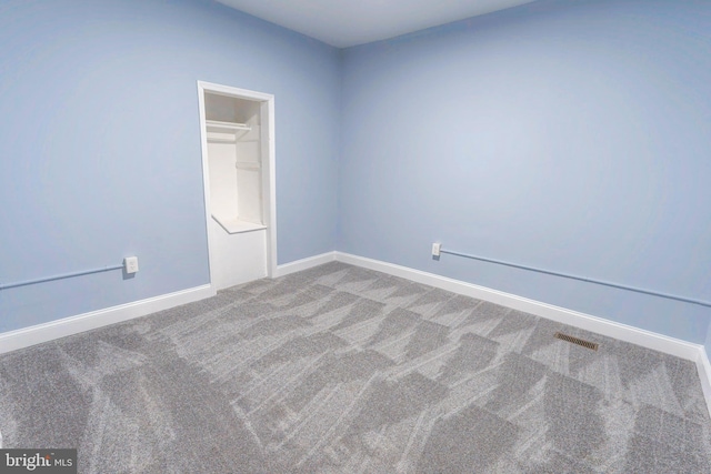 3211 Baker St, Baltimore, MD 21216 - carpeted spare room featuring baseboards