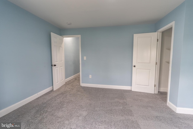 3211 Baker St, Baltimore, MD 21216 - carpeted empty room featuring baseboards
