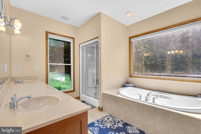 10150 Lapworth Pl, Charlotte Hall, MD 20622 - bathroom featuring tile patterned floors, double vanity, a bath, and a shower stall