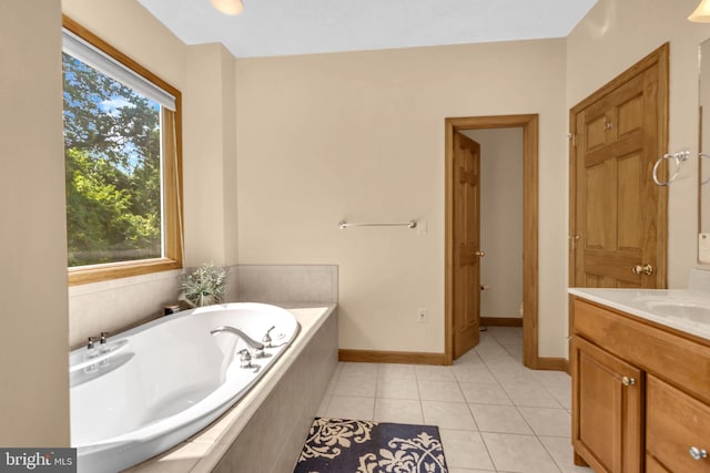 10150 Lapworth Pl, Charlotte Hall, MD 20622 - full bath with vanity, a garden tub, tile patterned floors, and baseboards