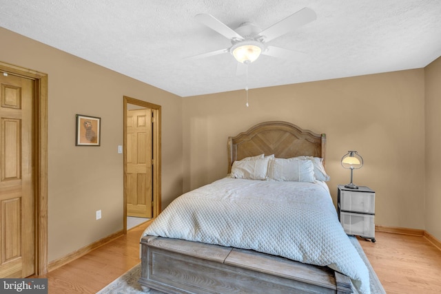 10150 Lapworth Pl, Charlotte Hall, MD 20622 - bedroom featuring light wood-style flooring, a textured ceiling, baseboards, and a ceiling fan