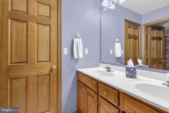 10150 Lapworth Pl, Charlotte Hall, MD 20622 - full bath featuring double vanity and a textured ceiling