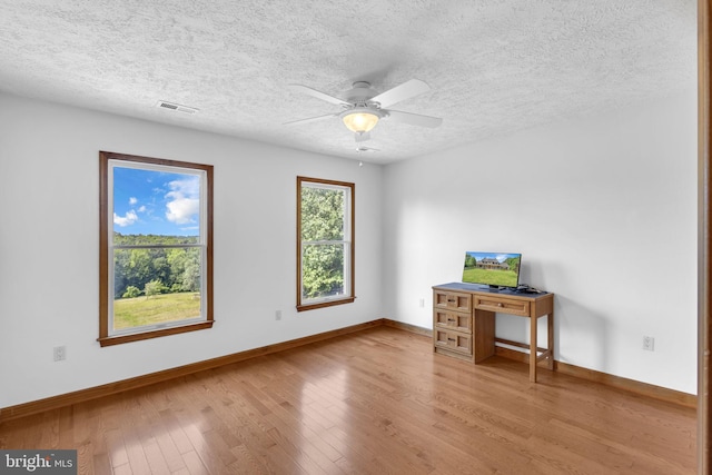 10150 Lapworth Pl, Charlotte Hall, MD 20622 - unfurnished office with baseboards, light wood-style flooring, ceiling fan, and a textured ceiling
