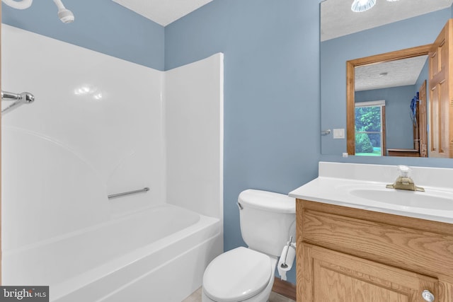 10150 Lapworth Pl, Charlotte Hall, MD 20622 - bathroom featuring vanity, toilet, washtub / shower combination, and a textured ceiling