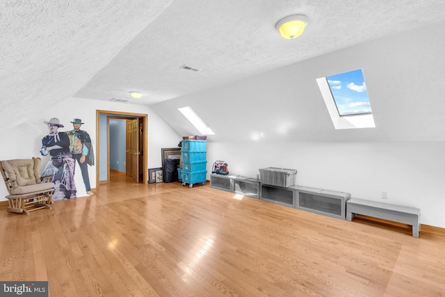 10150 Lapworth Pl, Charlotte Hall, MD 20622 - bonus room featuring a skylight, wood finished floors, a textured ceiling, vaulted ceiling, and baseboards
