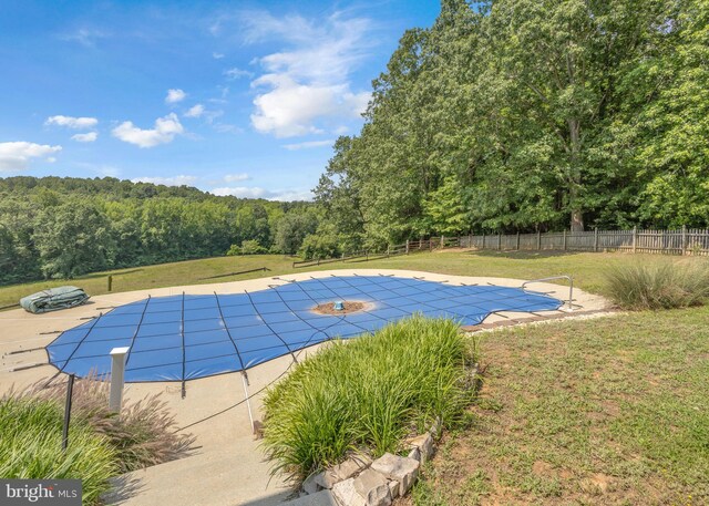 10150 Lapworth Pl, Charlotte Hall, MD 20622 - view of swimming pool with a wooded view and a patio