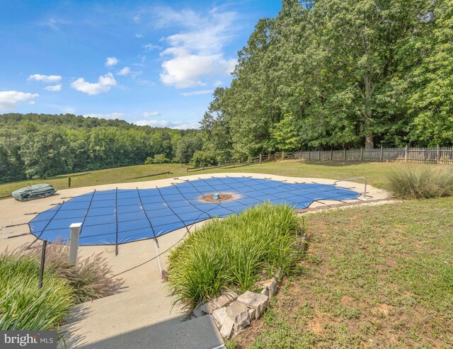 10150 Lapworth Pl, Charlotte Hall, MD 20622 - view of swimming pool featuring a forest view and a patio area
