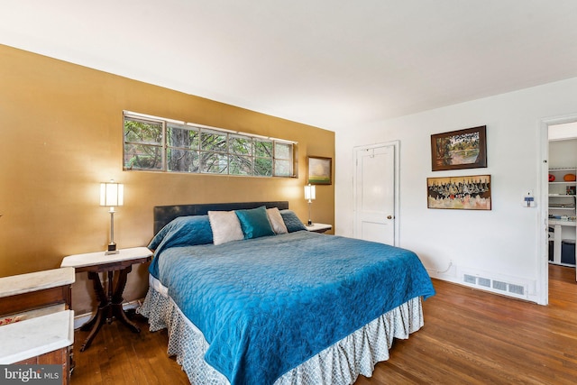 bedroom with wood finished floors