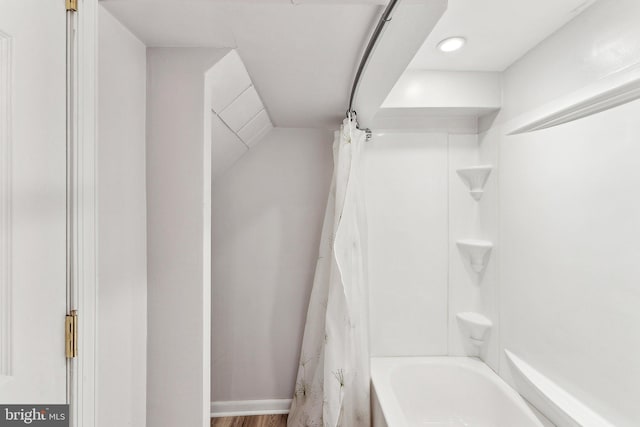 bathroom featuring shower / bathtub combination with curtain