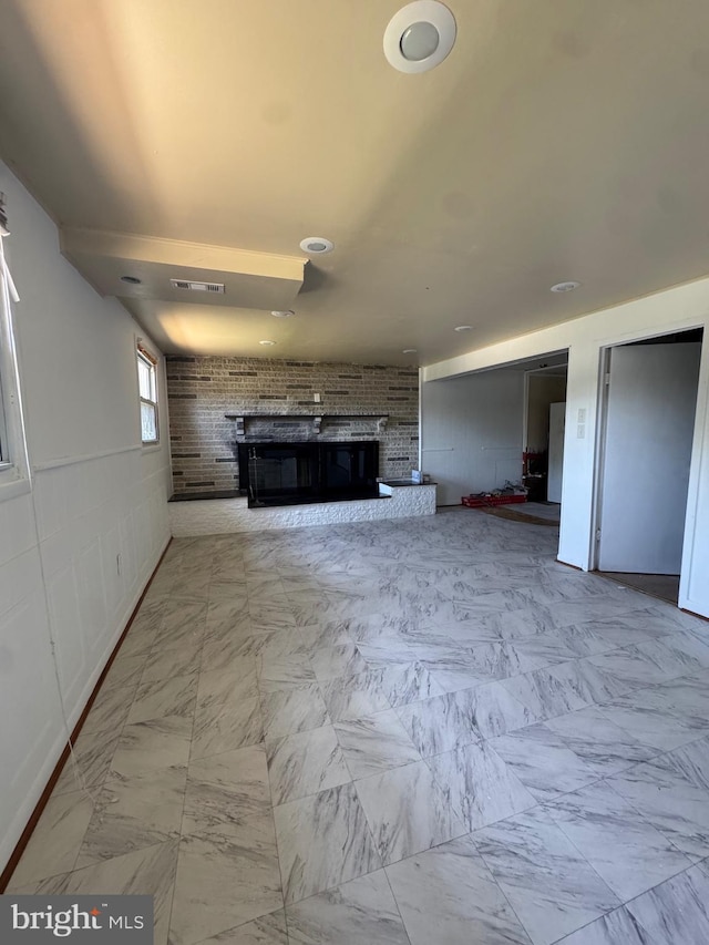 6708 Calmos St, Capitol Heights, MD 20743 - unfurnished living room with a brick fireplace and marble look tiles