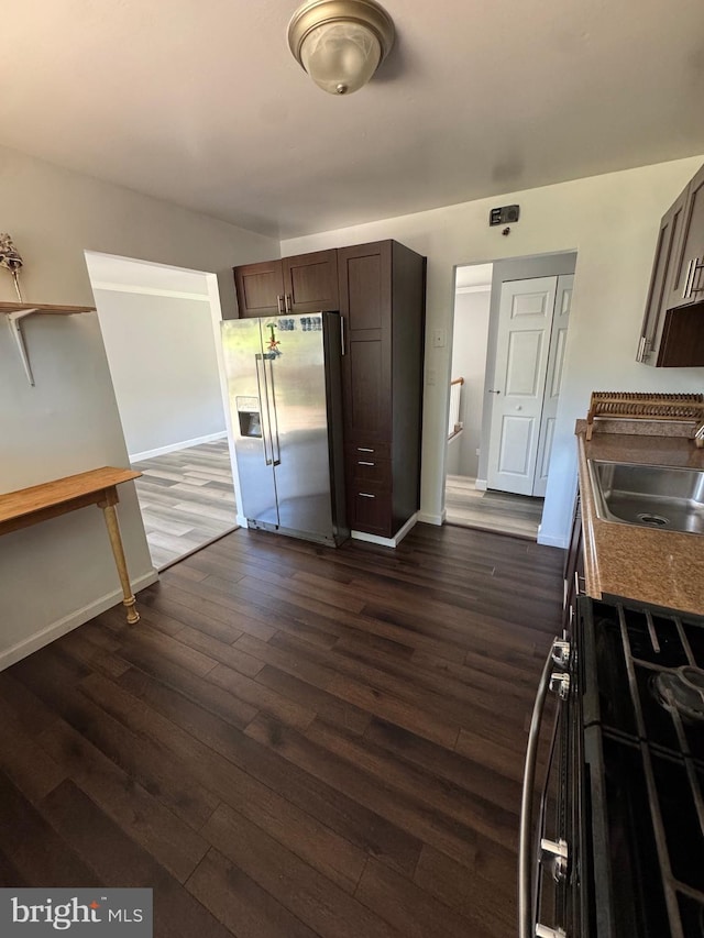 6708 Calmos St, Capitol Heights, MD 20743 - kitchen featuring stainless steel fridge with ice dispenser, a sink, gas stove, and baseboards