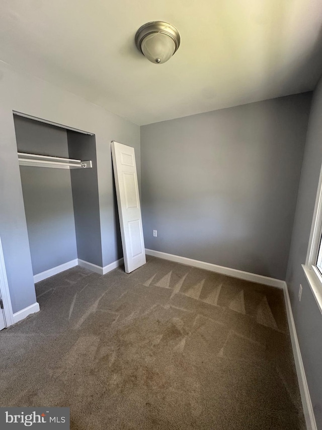 6708 Calmos St, Capitol Heights, MD 20743 - unfurnished bedroom featuring carpet flooring, a closet, and baseboards