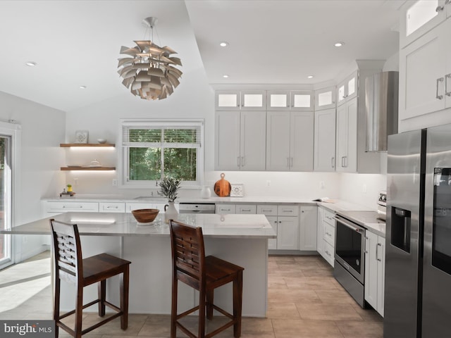 kitchen featuring stainless steel appliances, a kitchen breakfast bar, white cabinets, glass insert cabinets, and recessed lighting