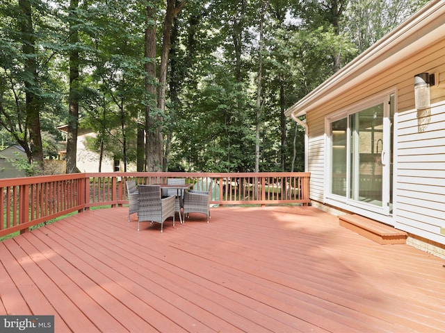 deck featuring outdoor dining area