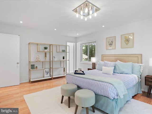 bedroom featuring wood finished floors and recessed lighting
