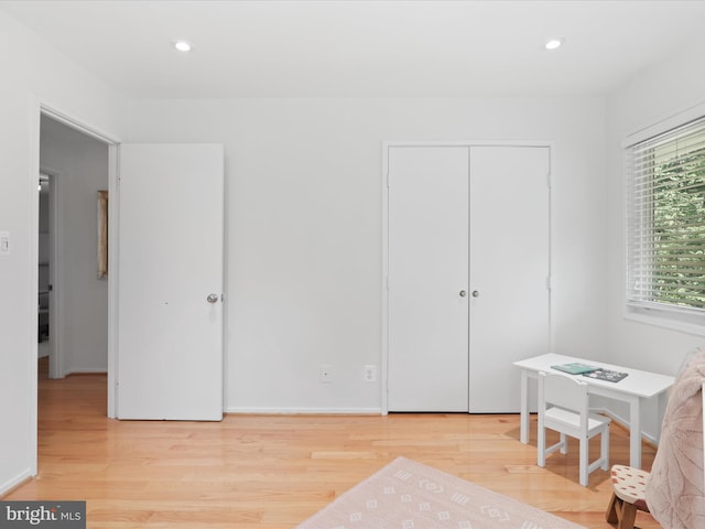 home office featuring wood finished floors and recessed lighting