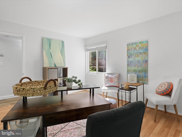 living room with light wood-style floors and baseboards