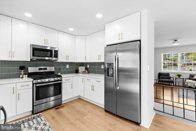 504 Kenora Dr, Millersville, MD 21108 - kitchen featuring stainless steel appliances, light countertops, light wood-type flooring, and recessed lighting