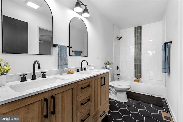 504 Kenora Dr, Millersville, MD 21108 - bathroom featuring double vanity, tile patterned flooring, toilet, and shower / bath combination
