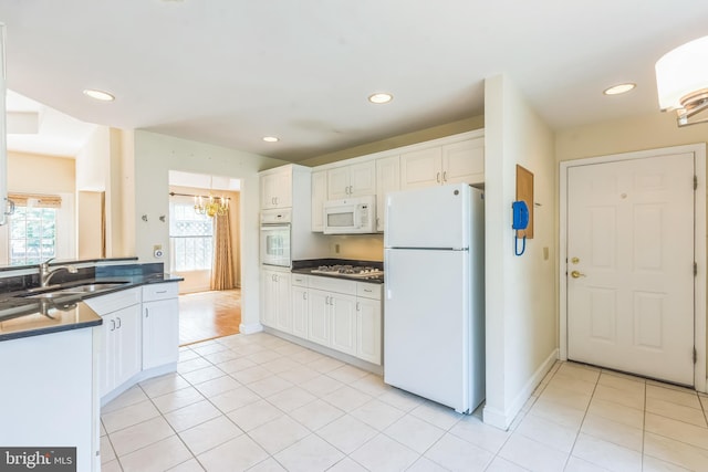 2 Larch Way, Princeton, NJ 08540 - kitchen with white appliances, dark countertops, white cabinets, recessed lighting, and light tile patterned floors