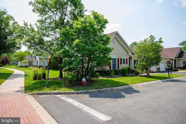 2 Larch Way, Princeton, NJ 08540 - view of property hidden behind natural elements featuring a front yard, a residential view, and an attached garage