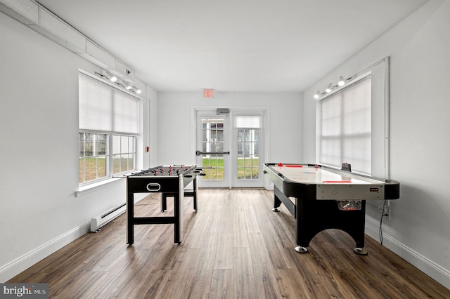3201 Centennial Sta, Warminster, PA 18974 - recreation room with a baseboard heating unit, wood finished floors, and baseboards