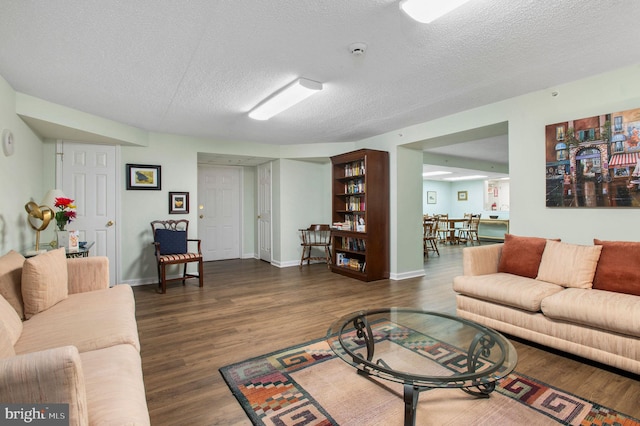 3201 Centennial Sta, Warminster, PA 18974 - living area featuring a textured ceiling, wood finished floors, and baseboards