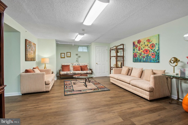 3201 Centennial Sta, Warminster, PA 18974 - living area featuring a textured ceiling, wood finished floors, and baseboards