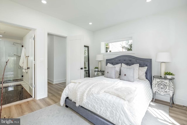 426 Manor Pl NW Unit 1, Washington, DC 20010 - bedroom featuring recessed lighting, wood finished floors, baseboards, and ensuite bathroom