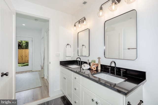 426 Manor Pl NW Unit 1, Washington, DC 20010 - bathroom featuring baseboards, double vanity, and recessed lighting