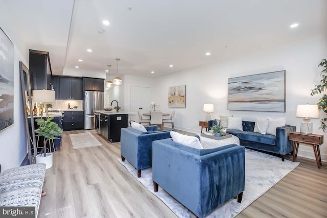 426 Manor Pl NW Unit 1, Washington, DC 20010 - living room with light wood-style flooring, recessed lighting, and baseboards