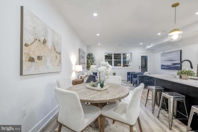 426 Manor Pl NW Unit 1, Washington, DC 20010 - dining area with light wood-type flooring, recessed lighting, and baseboards