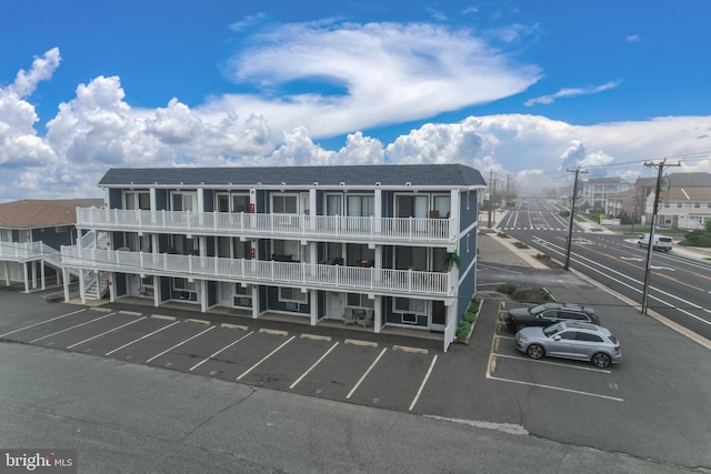 view of property with uncovered parking