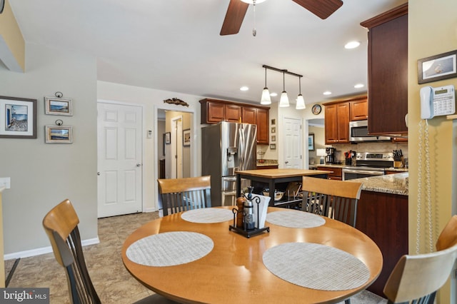 dining area featuring ceiling fan, recessed lighting, and baseboards