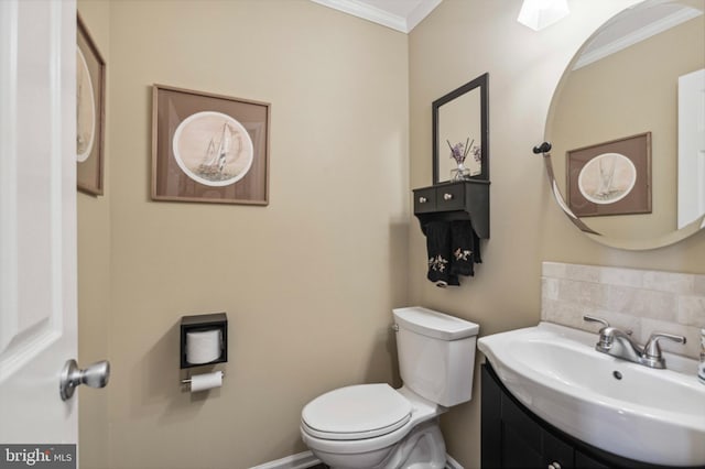 half bathroom with ornamental molding, toilet, tasteful backsplash, and vanity