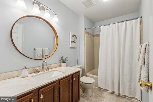 full bathroom with toilet, vanity, shower / bath combo with shower curtain, and tile patterned flooring