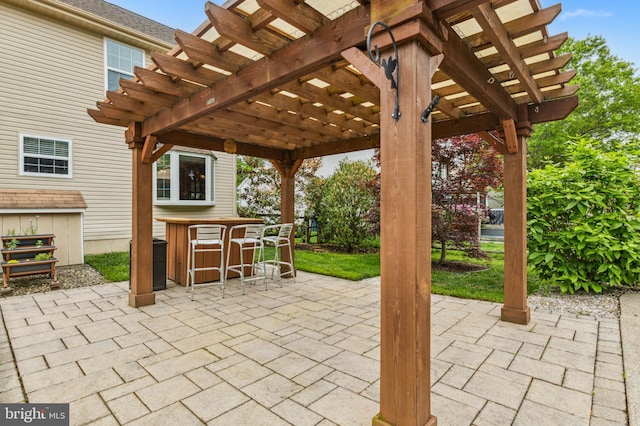 view of patio / terrace featuring a pergola and central AC unit
