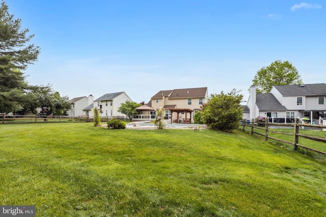 view of yard featuring a residential view and a pergola