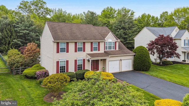 view of front of house featuring driveway and a garage