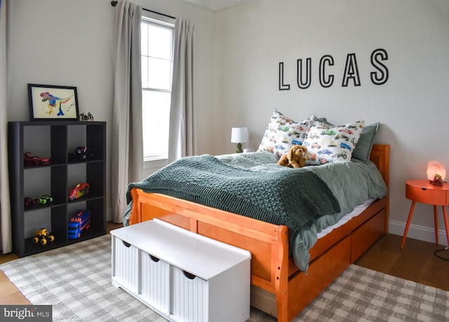 bedroom featuring baseboards