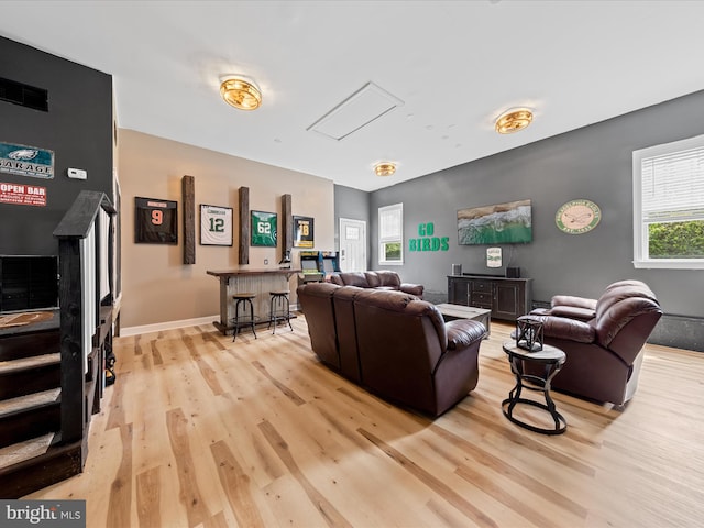 30106 Pelican Beach Cir, Dagsboro, DE 19939 - living room featuring light wood-type flooring, a dry bar, and baseboards