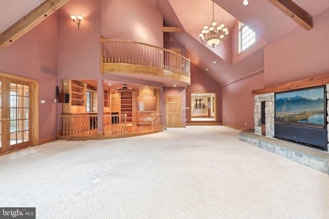 2619 New Falls Rd, Levittown, PA 19056 - unfurnished living room featuring a ceiling fan, carpet floors, high vaulted ceiling, baseboards, and a chandelier