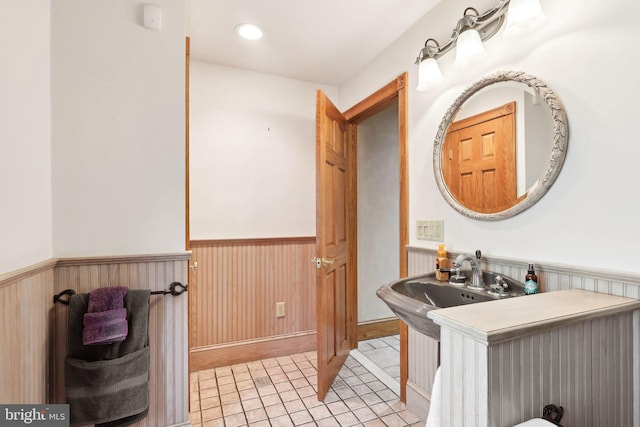 2619 New Falls Rd, Levittown, PA 19056 - bathroom with wainscoting, tile patterned flooring, a sink, and wooden walls
