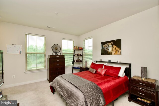 10810 Norbourne Farm Rd, Upper Marlboro, MD 20772 - carpeted bedroom featuring baseboards and multiple windows