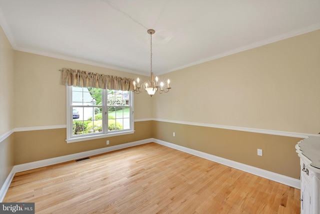 488 Seedling Ct, Mechanicsburg, PA 17055 - spare room featuring a chandelier, light wood finished floors, baseboards, and ornamental molding