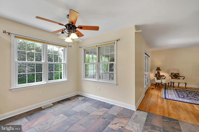 488 Seedling Ct, Mechanicsburg, PA 17055 - unfurnished room featuring healthy amount of natural light, baseboards, and stone tile flooring