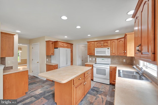 488 Seedling Ct, Mechanicsburg, PA 17055 - kitchen featuring white appliances, a sink, a kitchen island, tasteful backsplash, and light countertops