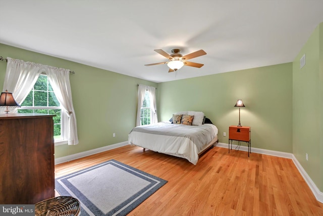 488 Seedling Ct, Mechanicsburg, PA 17055 - bedroom featuring light wood finished floors, multiple windows, and baseboards
