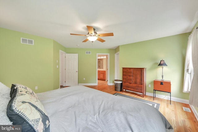 488 Seedling Ct, Mechanicsburg, PA 17055 - bedroom with wood finished floors, baseboards, ceiling fan, and ensuite bath