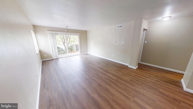 10239 Prince Pl Unit 26-T1, Upper Marlboro, MD 20774 - empty room with wood finished floors and baseboards
